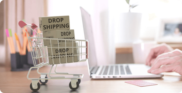 Una imagen de un carro de la compra con cajas donde pone dropshipping